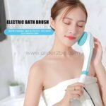 Woman using electric cleansing brush on her neck and jawline while wrapped in a towel.