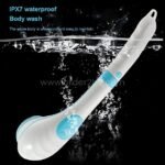 Electric shower brush fully submerged in water on a dark background, highlighting waterproof feature.