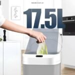 Person uses the hands-free motion sensor on a touchless kitchen bin while cooking.